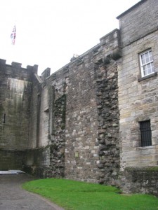 Scars of removed James IV flanking tower in curtain wall